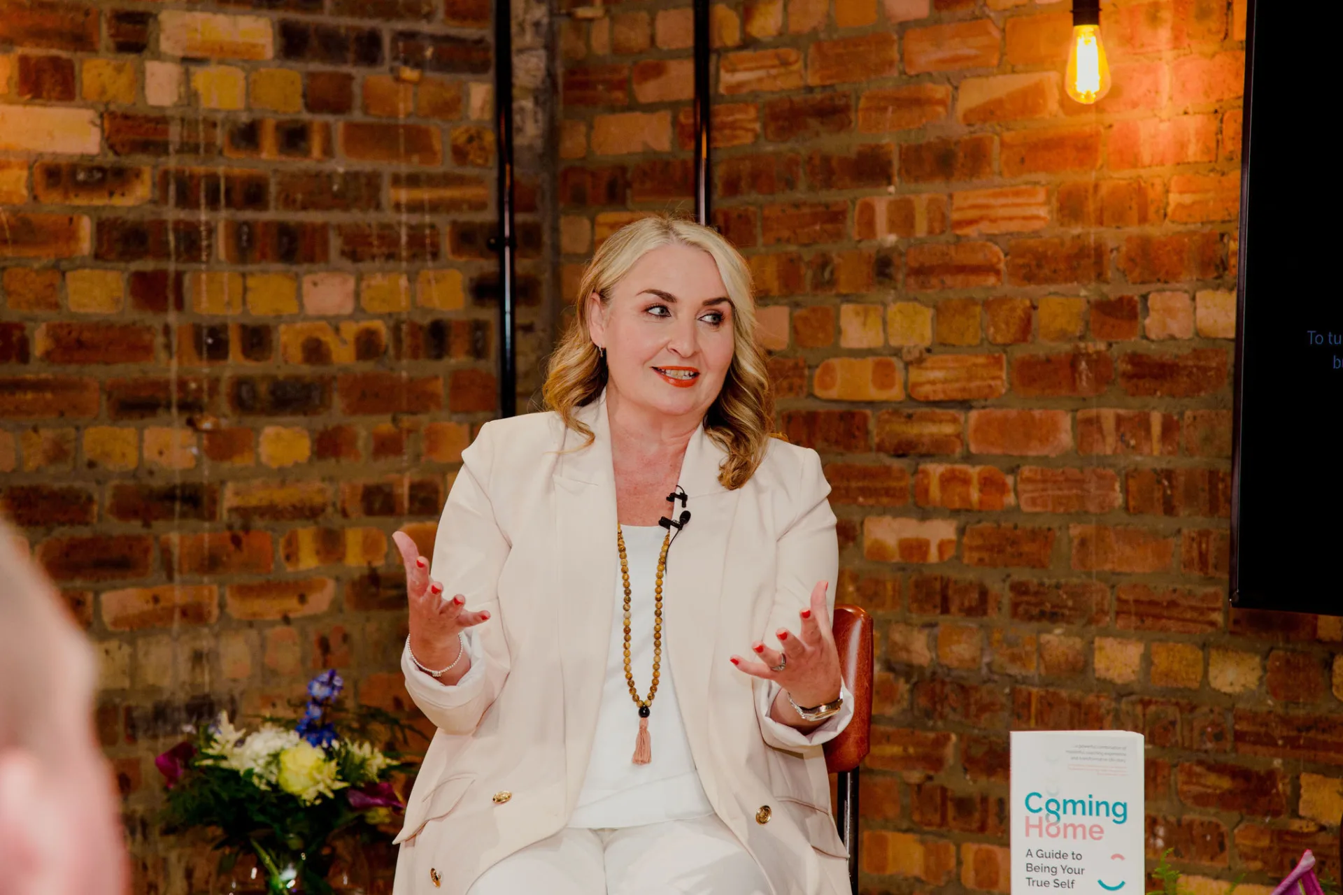 Gillian coach speaking on stage spiritual coach woman speaking on stage